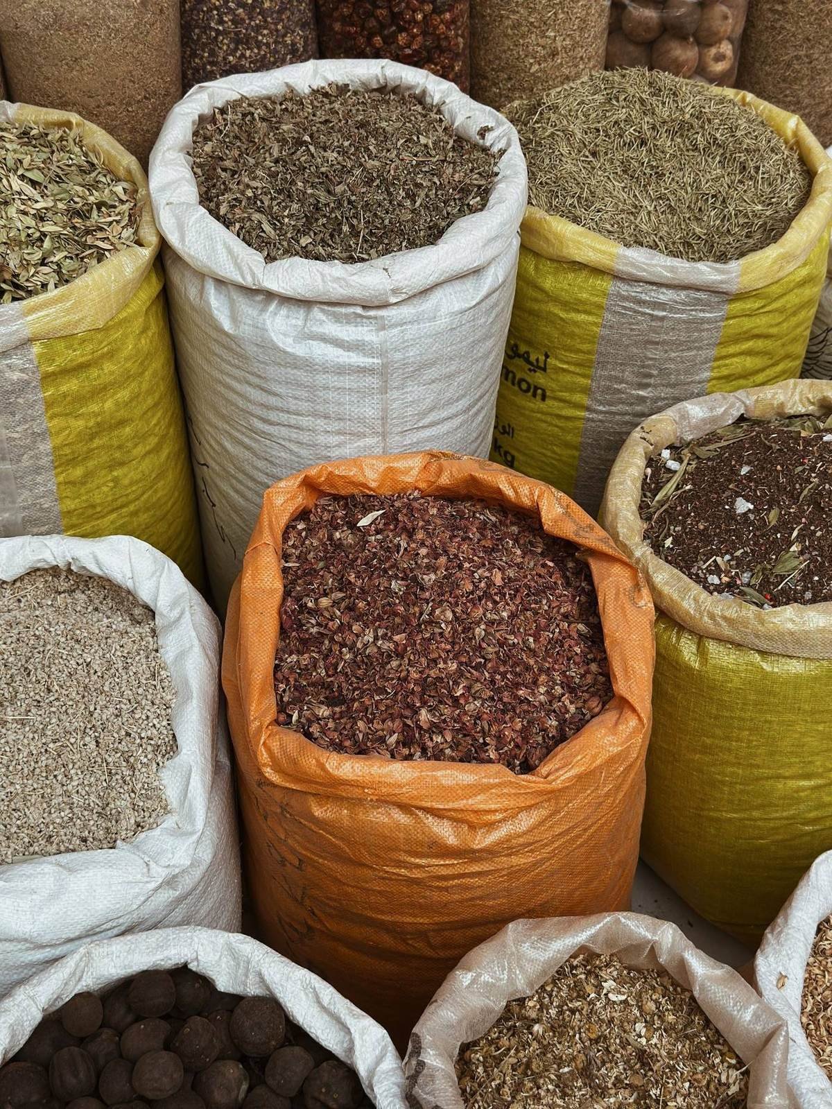 Sacks of dried herbs and spices ready for sorting