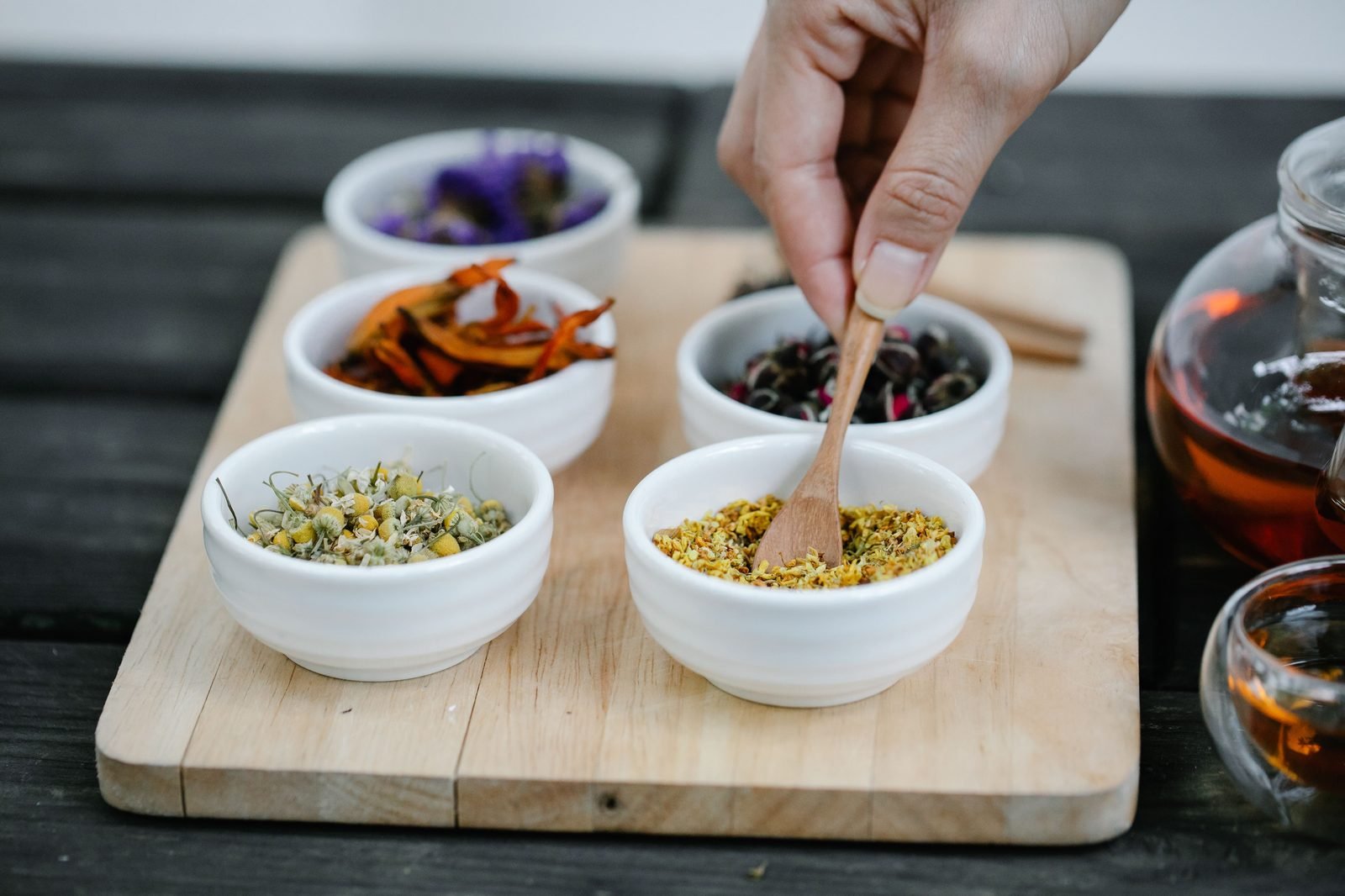 Close inspection of dried botanicals during blending